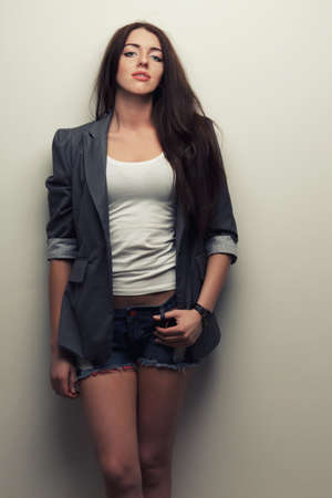 woman fashion studio portrait over white wallの写真素材