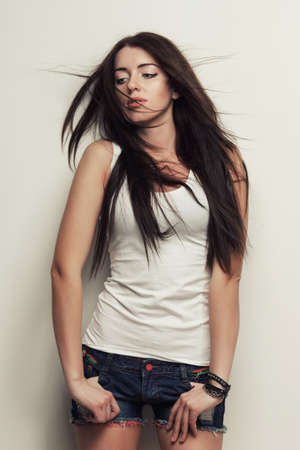 woman fashion studio portrait , posing over wallの写真素材