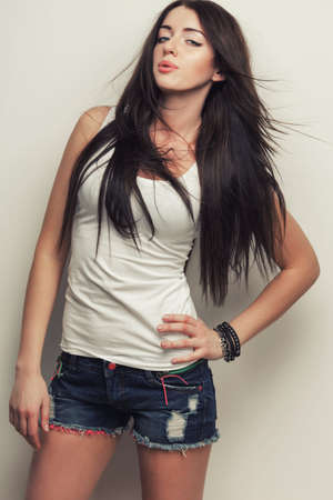 woman fashion studio portrait , posing over wallの写真素材