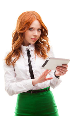 red businesswoman holding tablet isolated over whiteの写真素材