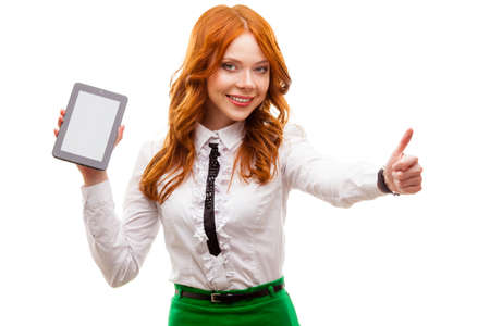 red businesswoman holding tablet isolated over whiteの写真素材