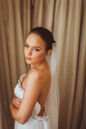 portrait of beautiful brunette bride indoorsの写真素材