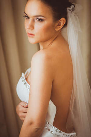 portrait of beautiful brunette bride indoorsの写真素材