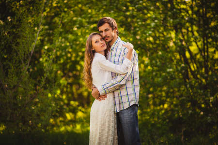 couple in love hugging at summer parkの写真素材