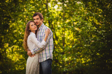 couple in love hugging at summer parkの写真素材