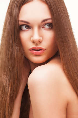 beautiful closeup woman portrait with long hair over whiteの写真素材