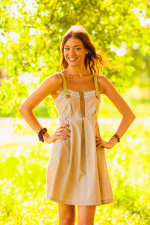 happy girl walking in the green summer parkの写真素材