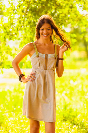 happy girl walking in the green summer parkの写真素材
