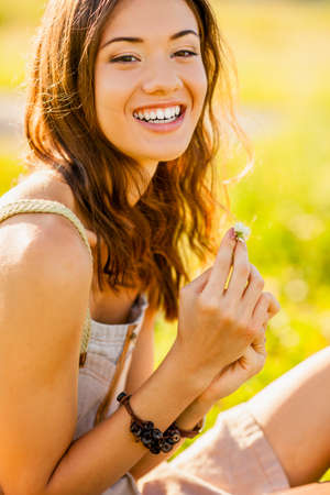 closeup happy beautiful girl outdoors portraitの写真素材