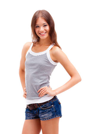 girl standing on white background, wearing shortsの写真素材