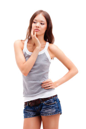 girl standing on white background, wearing shortsの写真素材
