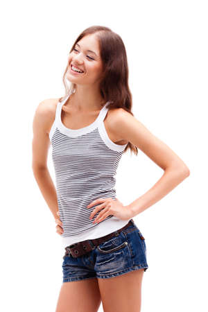 girl standing on white background, wearing shortsの写真素材