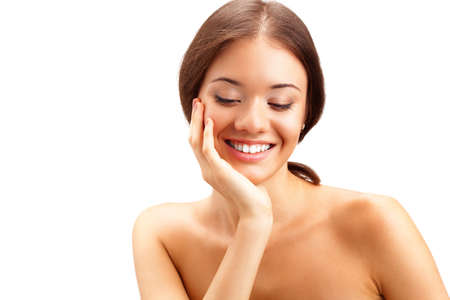 beautiful woman looking down and smiling over whiteの写真素材
