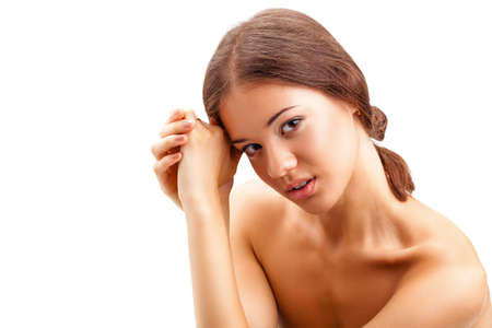 closeup portrait of beautiful smiling  woman with hands and naked shouldresの写真素材