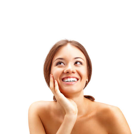 beautiful brunette woman looking  up and smilingの写真素材