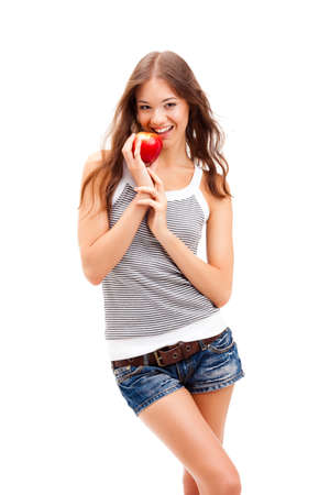 woman portrait with red apple in handsの写真素材