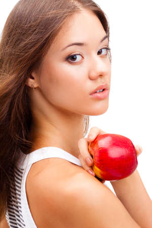 closeup woman face portrait with apple in handの写真素材