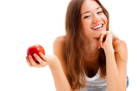 lying woman portrait with big red appleの写真素材