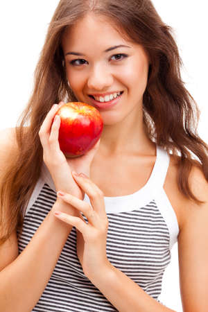closeup woman face portrait with apple in handsの写真素材