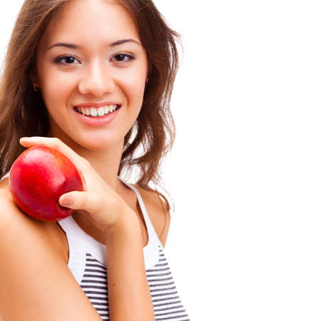 closeup woman face portrait with apple in handの写真素材