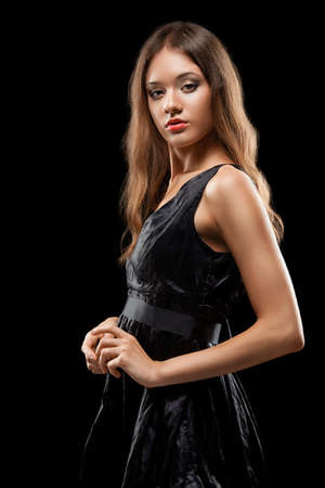beautiful woman fashion portrait  over dark backgroundの写真素材