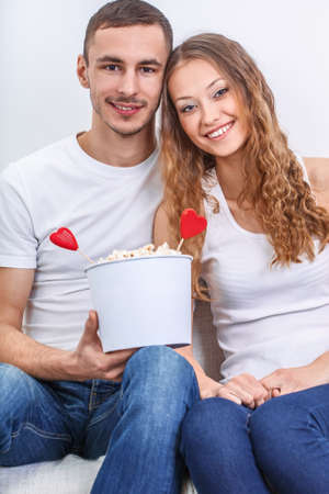 couple with pop corn ad heart symbols, valentines day symbolsの写真素材