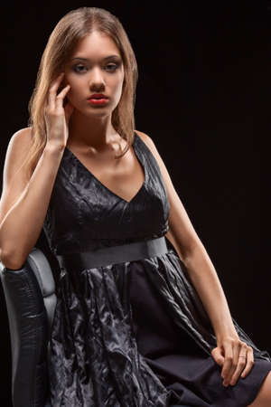 beautiful woman fashion portrait  over dark backgroundの写真素材