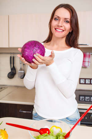 beautiful caucasian woman in the kitchenの写真素材