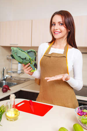 beautiful caucasian woman in the kitchenの写真素材