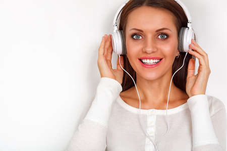 happy smiling woman with headphones relax with musicの写真素材