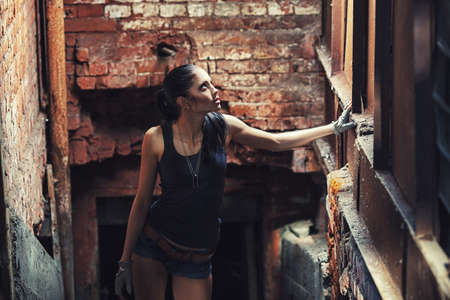 sexy soldier woman on factory ruins, action movie themeの写真素材