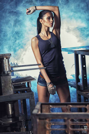 sexy soldier woman on factory ruins, action movie themeの写真素材