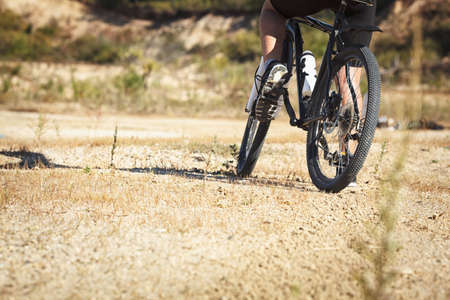 athlete man cycling on a bicycle ounddors in stone pitの写真素材