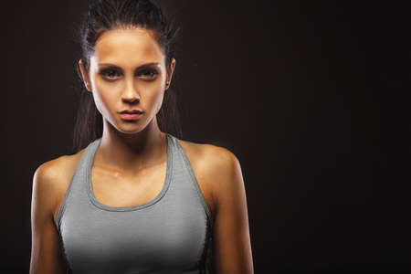 closeup portrait of sporty beautiful brunette womanの写真素材