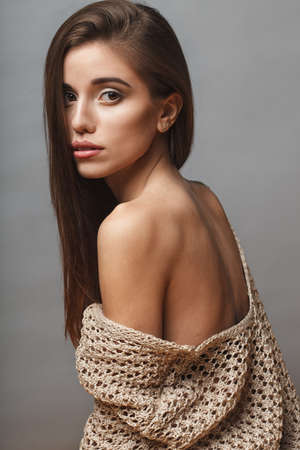 beautiful fashion model closeup portrait over gray backgroundの写真素材