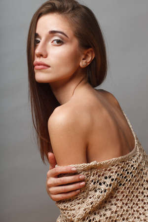 beautiful fashion model closeup portrait over gray backgroundの写真素材