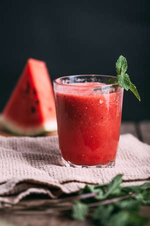 watermelon smoothie in the glass rusitc style verticalの写真素材
