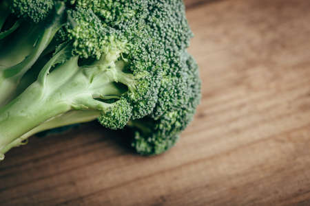 Fresh green broccoli on wood table, closeup, copy space for textの写真素材