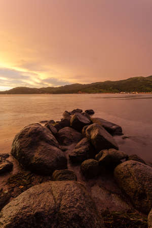 dramatic sunset skies in the sea bay, rainy eveningの写真素材