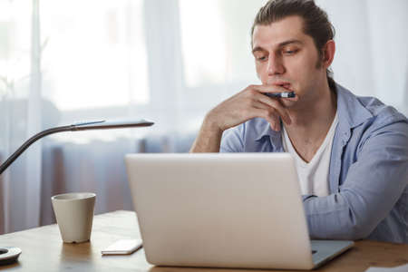 portrait of working man at his homeの写真素材