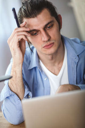 portrait of working man at his homeの写真素材