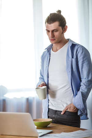 portrait of working man at his homeの写真素材
