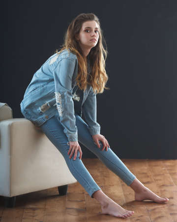 young teenage girl wearing jeans jacketの写真素材