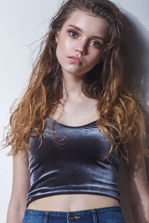 model girl tests portrait over dark backgroundの写真素材