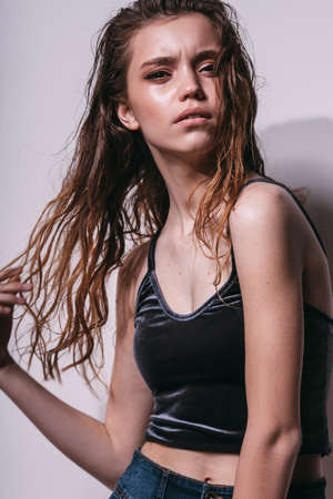 model girl tests portrait over dark backgroundの写真素材