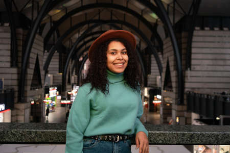 Yong african descent woman portrait at the railway stationの写真素材