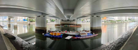 Shatin, Hong Kong - 6 Sept 2021: Panorama of Shing Mun River and dragon boats parking under a bridgeのeditorial素材