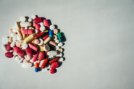 Colorful pills isloated on white tableの写真素材