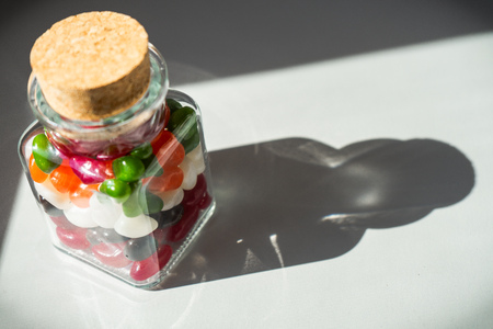 Glass jar full of candiesの写真素材