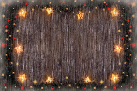 New Years and Christmas background with a glowing garland of stars, fir branches, lights.の写真素材